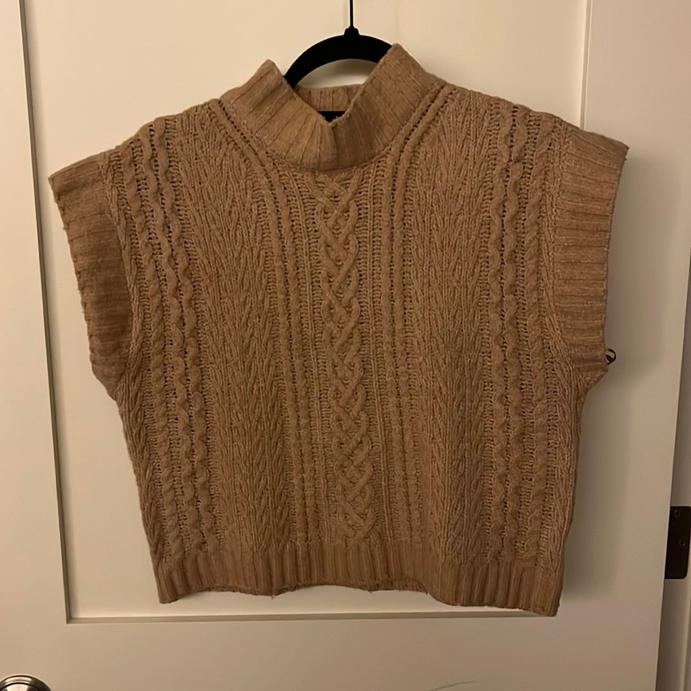 Sleeveless cable-knit sweater